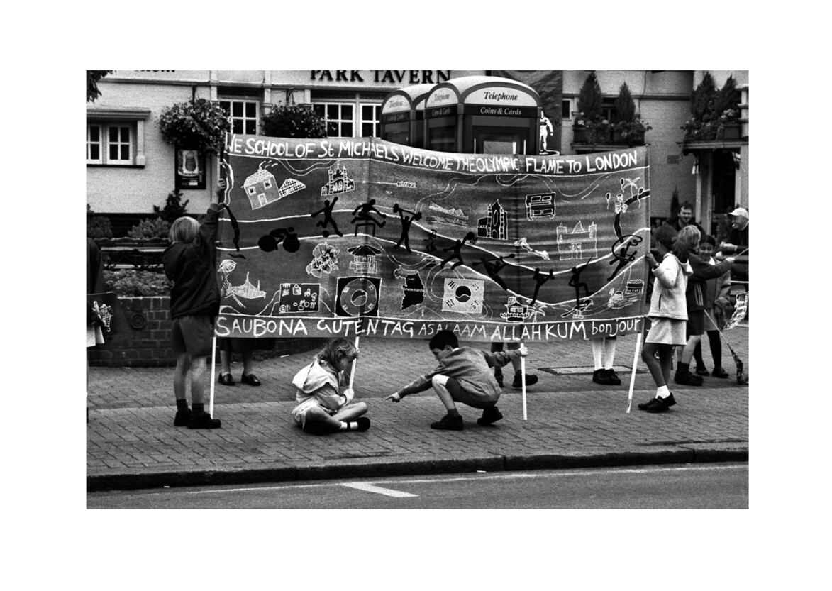 Waiting for Olympic torch relay / Merton Road SW18 / June 2004